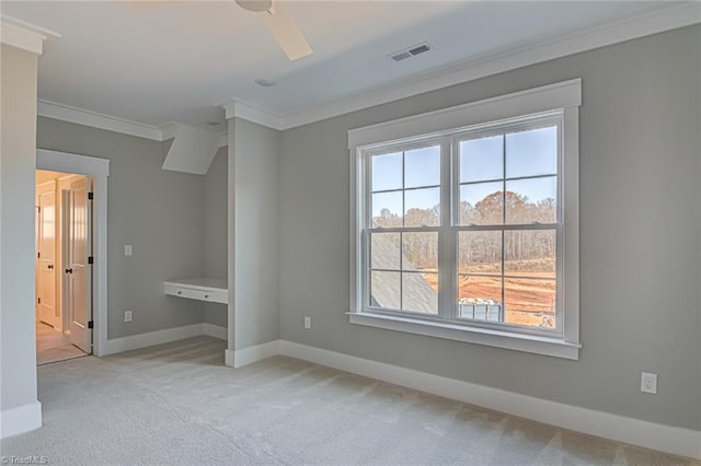 unfurnished bedroom with light carpet, baseboards, visible vents, ceiling fan, and ornamental molding