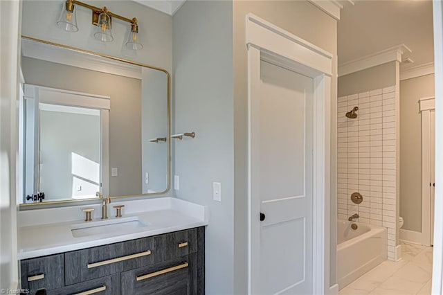 bathroom with toilet, vanity, marble finish floor,  shower combination, and crown molding