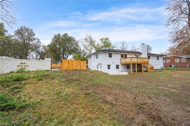 back of property featuring a deck