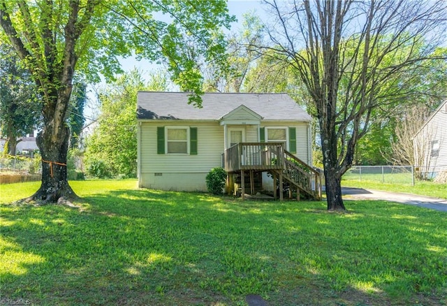 view of front of property featuring crawl space, fence, stairway, and a front yard