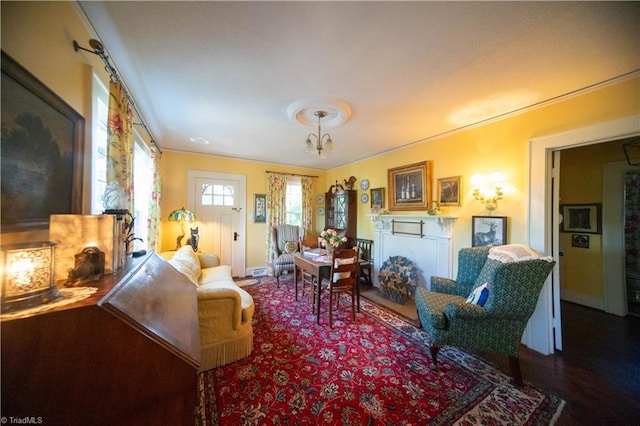 sitting room with hardwood / wood-style flooring