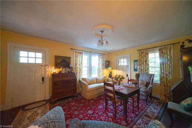 living room with an inviting chandelier and a healthy amount of sunlight