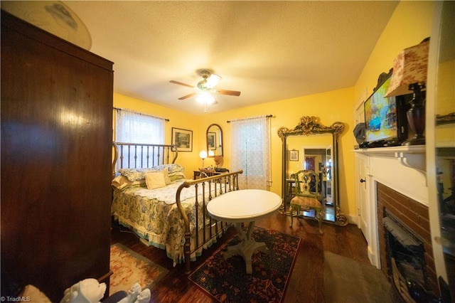 bedroom featuring ceiling fan and dark hardwood / wood-style flooring