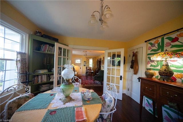 dining area featuring a notable chandelier and hardwood / wood-style floors