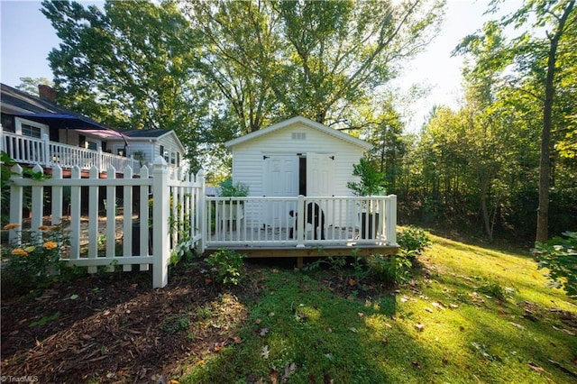 back of house featuring a deck