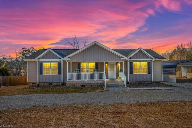 single story home featuring a porch and a carport