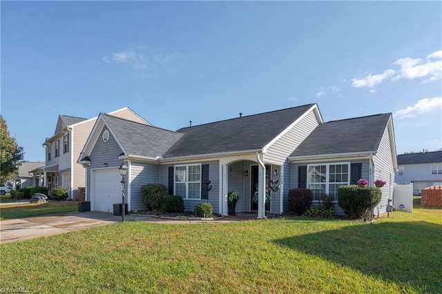 view of front of property with central AC unit, concrete driveway, a front lawn, and a garage