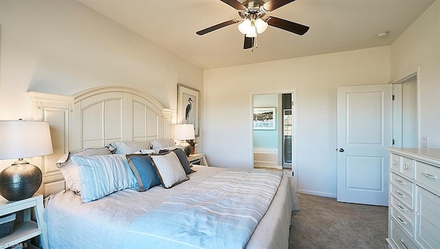 bedroom with a ceiling fan, carpet, baseboards, and ensuite bath