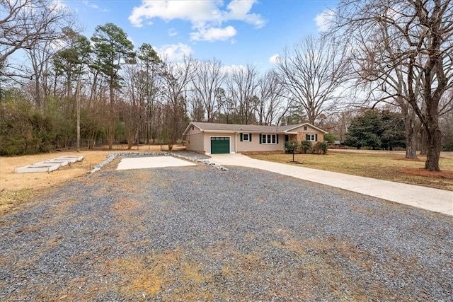 view of front facade with a garage and a front yard