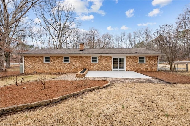 rear view of property featuring a patio area