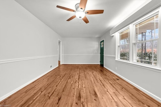 spare room featuring ceiling fan and light wood-type flooring