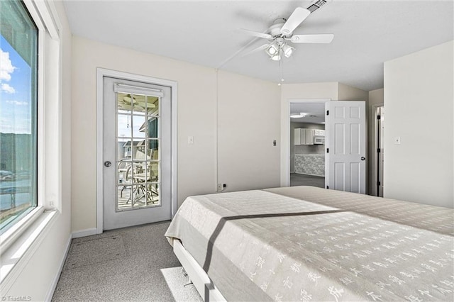 bedroom featuring visible vents, ceiling fan, and access to outside