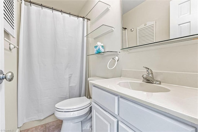 full bathroom with tile patterned floors, a shower with shower curtain, toilet, and vanity