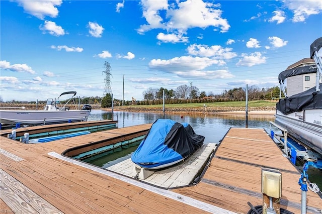 view of dock with a water view and boat lift