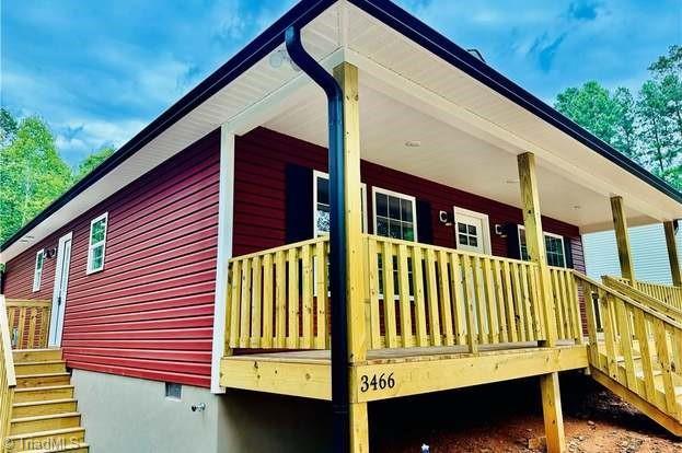 view of property exterior featuring crawl space and stairway