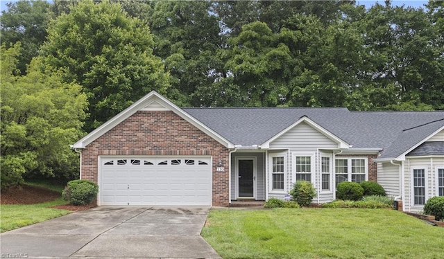 110 Miller Pointe Dr, Winston-Salem, NC 27106 - view of front of property with brick siding, concrete driveway, a garage, and a front lawn