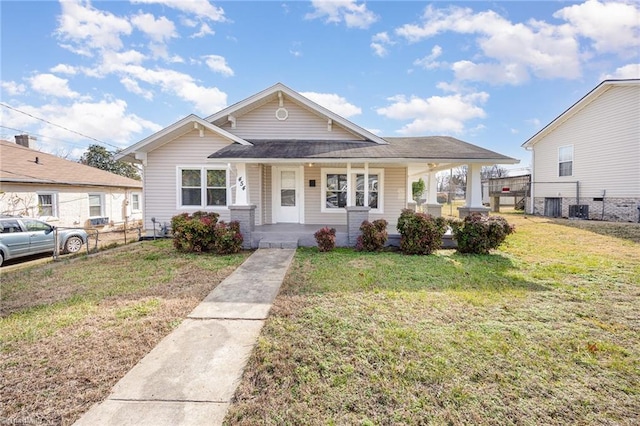 bungalow featuring a porch, central AC, and a front lawn