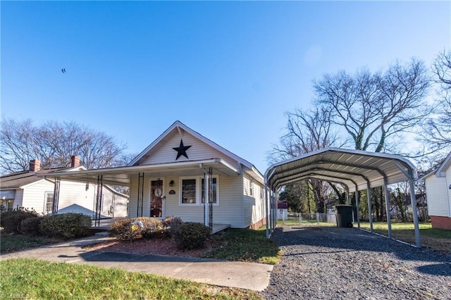 bungalow featuring a carport and covered porch