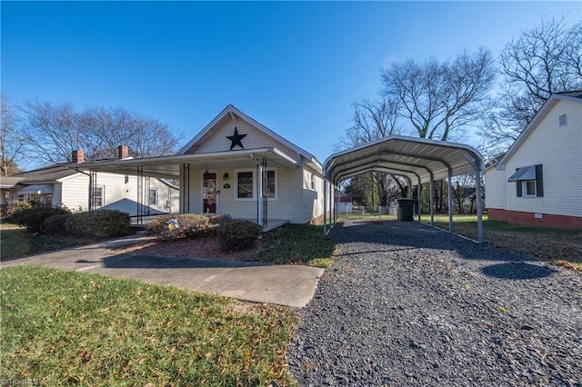 bungalow-style home featuring a porch and a carport