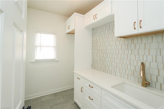 143 Wellesborough Rd, Winston-Salem, NC 27104 - mudroom featuring tile patterned flooring, baseboards, and a sink