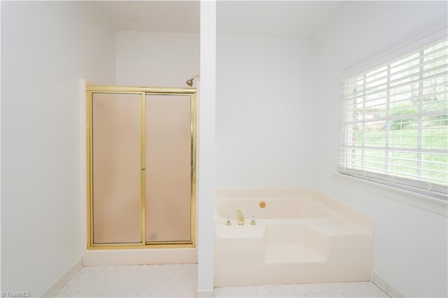 143 Wellesborough Rd, Winston-Salem, NC 27104 - full bathroom featuring baseboards, a shower stall, and a garden tub
