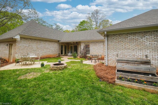 143 Wellesborough Rd, Winston-Salem, NC 27104 - rear view of property featuring a patio area and brick siding