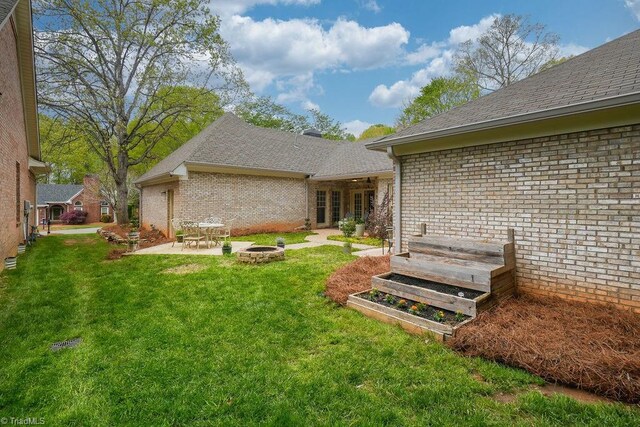 143 Wellesborough Rd, Winston-Salem, NC 27104 - view of yard with a garden, an outdoor fire pit, and a patio