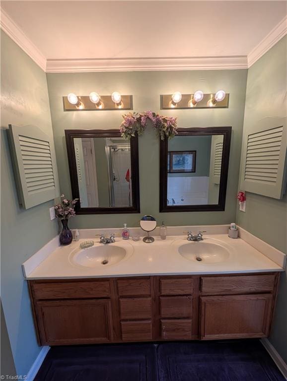 bathroom featuring ornamental molding, vanity, and a shower