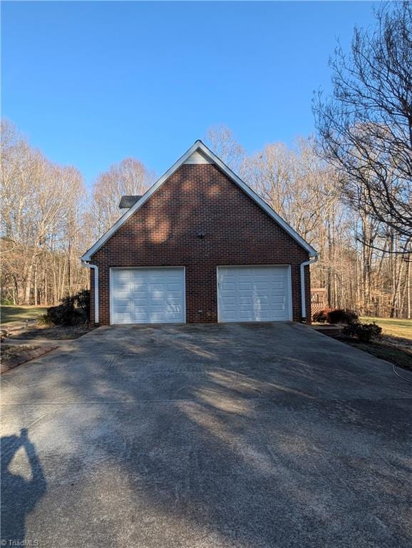 view of side of home with a garage