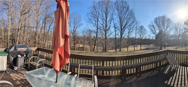 wooden terrace featuring area for grilling