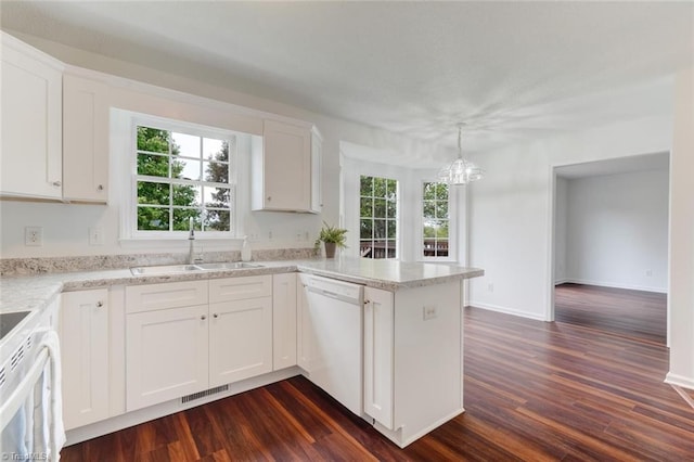 kitchen featuring dark wood-type flooring, white appliances, white cabinetry, and sink