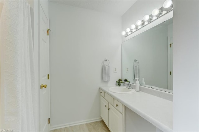 bathroom featuring vanity and hardwood / wood-style flooring