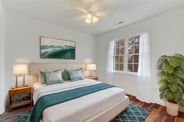 bedroom featuring ceiling fan and dark hardwood / wood-style floors