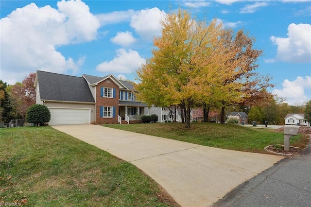 view of front of house with a garage and a front lawn