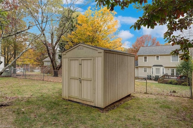 view of outdoor structure featuring a lawn