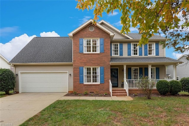 view of front of house with a garage, a porch, and a front lawn