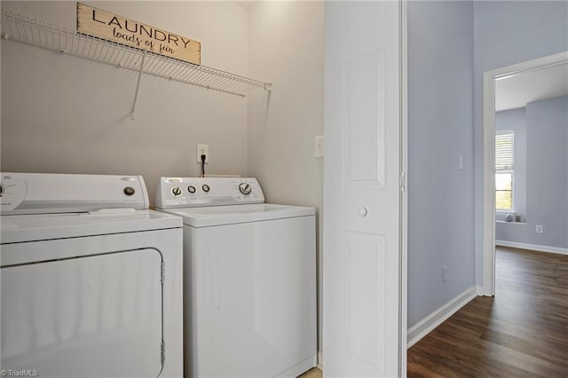 clothes washing area featuring separate washer and dryer and dark hardwood / wood-style flooring