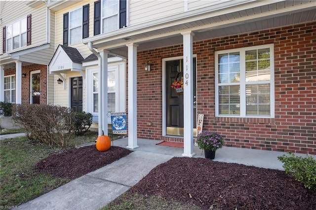 doorway to property featuring a porch