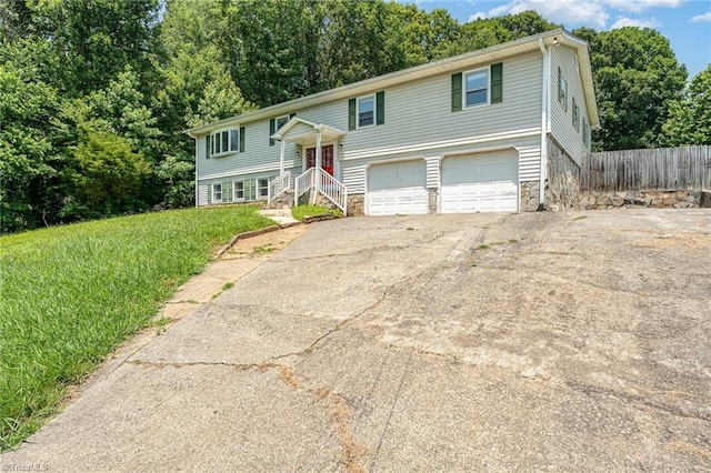 214 Whispering Creek Rd, King, NC 27021 - bi-level home with stone siding, driveway, and an attached garage