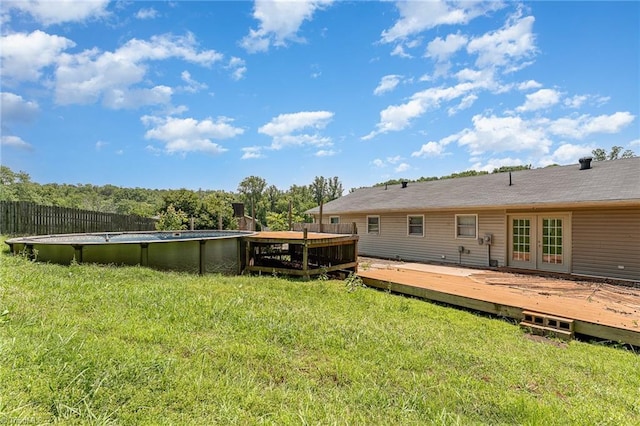 214 Whispering Creek Rd, King, NC 27021 - view of grassy yard with french doors, a deck, and an outdoor pool
