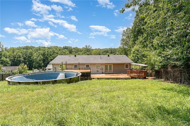 214 Whispering Creek Rd, King, NC 27021 - back of house featuring french doors, a wooden deck, and an empty pool