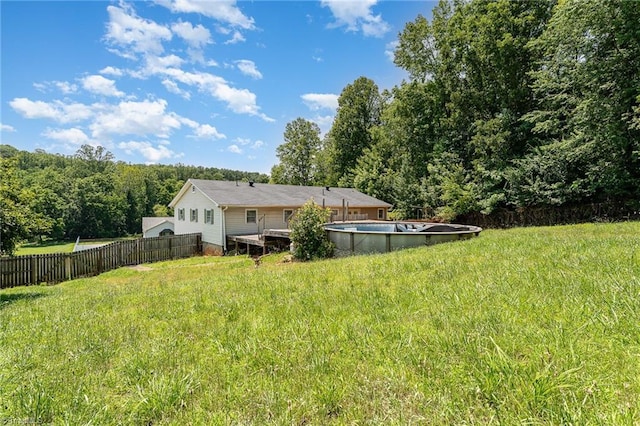 214 Whispering Creek Rd, King, NC 27021 - rear view of house featuring a view of trees