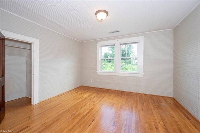 spare room with light wood-type flooring