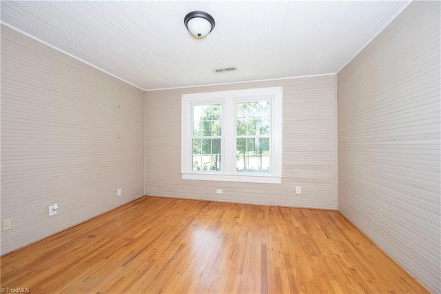 unfurnished room featuring light hardwood / wood-style floors