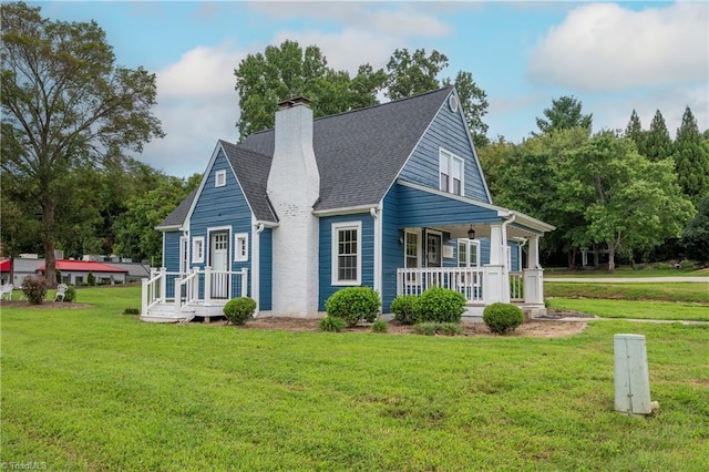 view of side of home with a porch and a yard