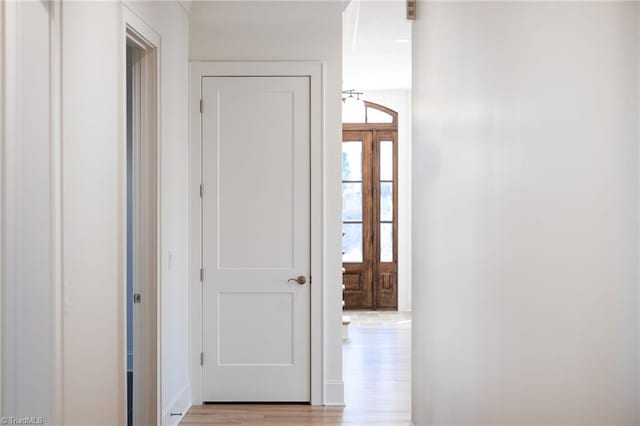 corridor featuring light hardwood / wood-style floors