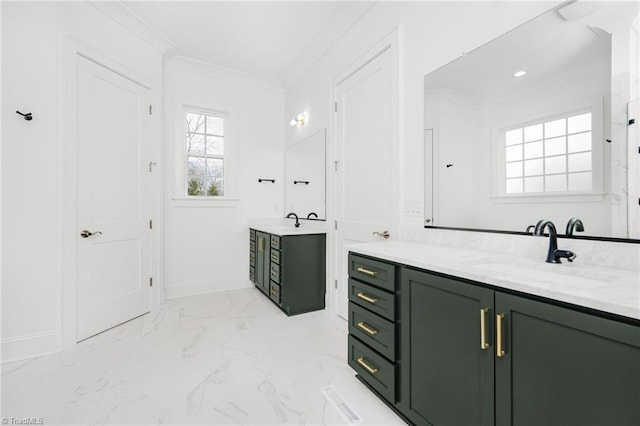 bathroom featuring ornamental molding and vanity