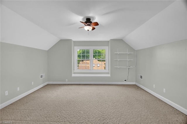 bonus room with carpet floors, vaulted ceiling, ceiling fan, and baseboards