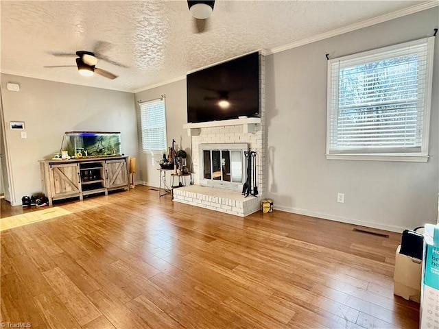 5314 Coble Church Rd, Julian, NC 27283 - living room featuring a ceiling fan, plenty of natural light, hardwood / wood-style flooring, and crown molding