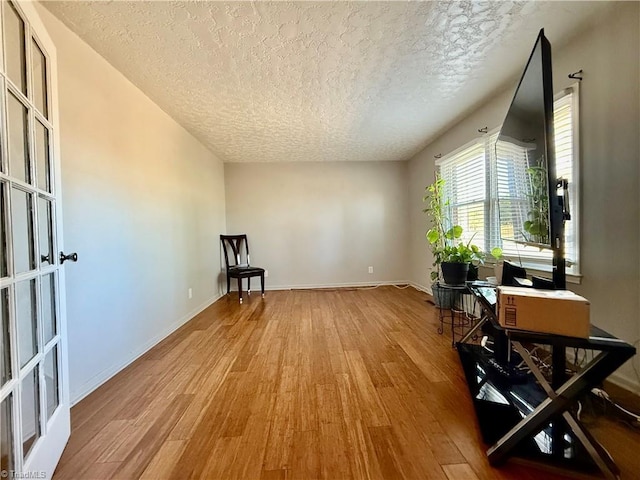 5314 Coble Church Rd, Julian, NC 27283 - interior space with french doors, a textured ceiling, baseboards, and wood finished floors